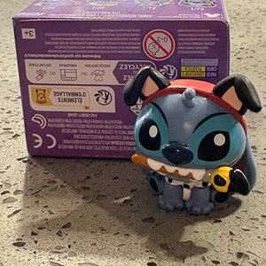 Blue and Black Cartoon Figure